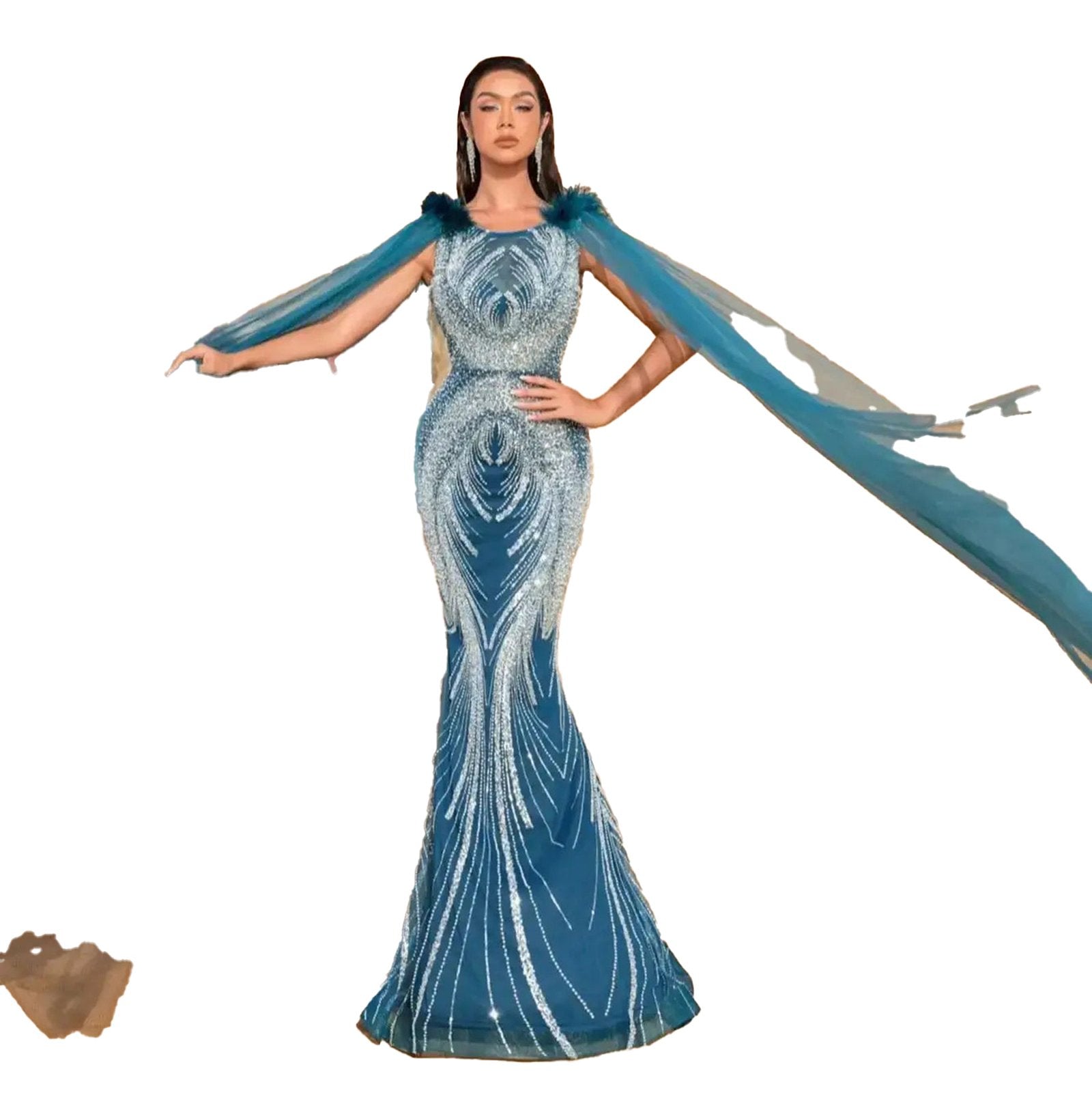 Stunning luxury beaded mermaid evening dress in teal featuring flowing cape sleeves for elegant occasions.