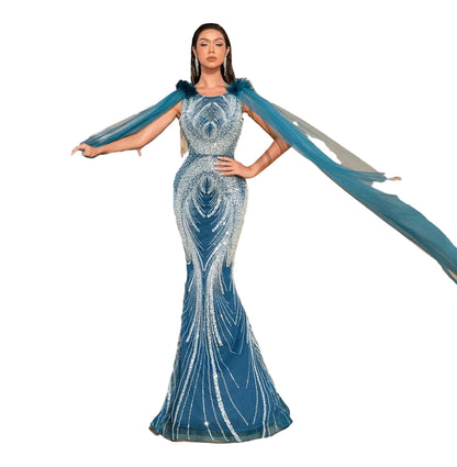 Luxury beaded mermaid evening dress in blue with elegant flowing cape sleeves