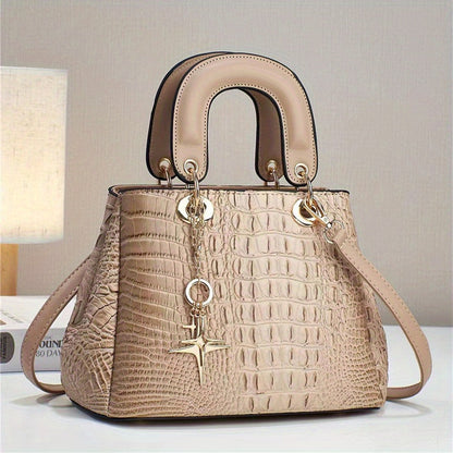 LuckeLadybug LLC luxury crocodile print handbag with elegant design and gold accents