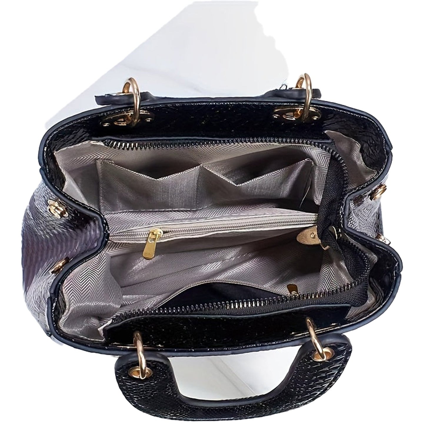 Interior view of a luxury crocodile print handbag with multiple compartments for organized storage