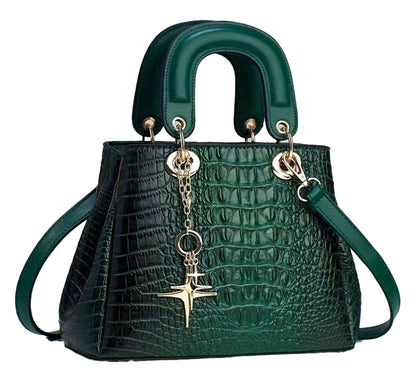 Luxurious crocodile print handbag in dark green with gold accents and a stylish charm