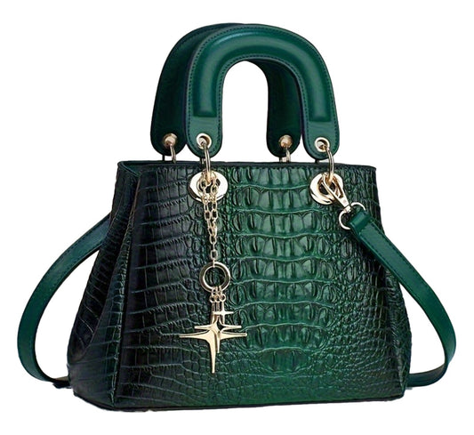 Luxurious crocodile print handbag in dark green with gold accents and a stylish charm