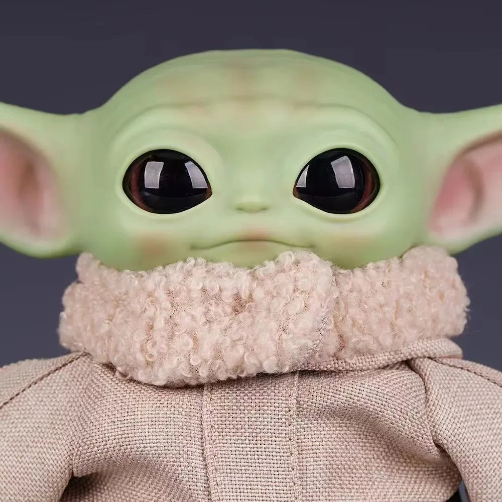 Cute Mandalorian action figure with oversized ears and soft clothing detail