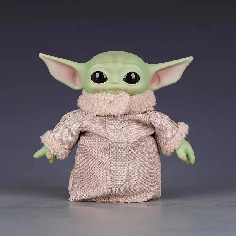 Cute Mandalorian action figure dressed in a cozy outfit with large ears and expressive eyes