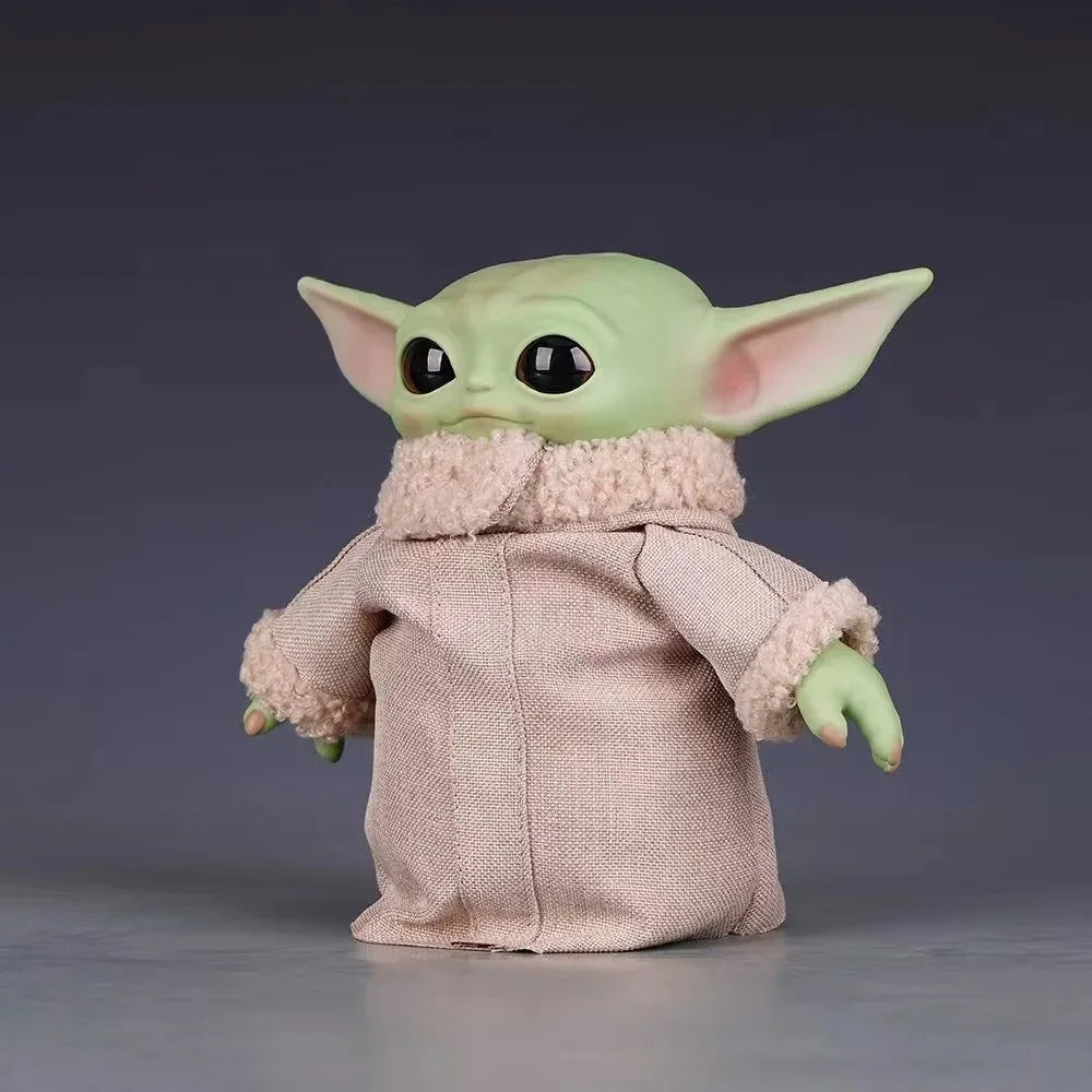 Cute mandalorian action figure featuring a green character in a cozy beige outfit