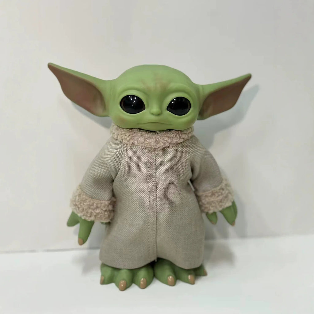 Mandalorian action figure featuring a cute character with large ears and a soft robe, perfect for collectors