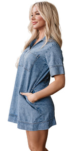 LuckeLadybug H Line model wearing a blue denim mini dress with pockets short sleeves and V collar