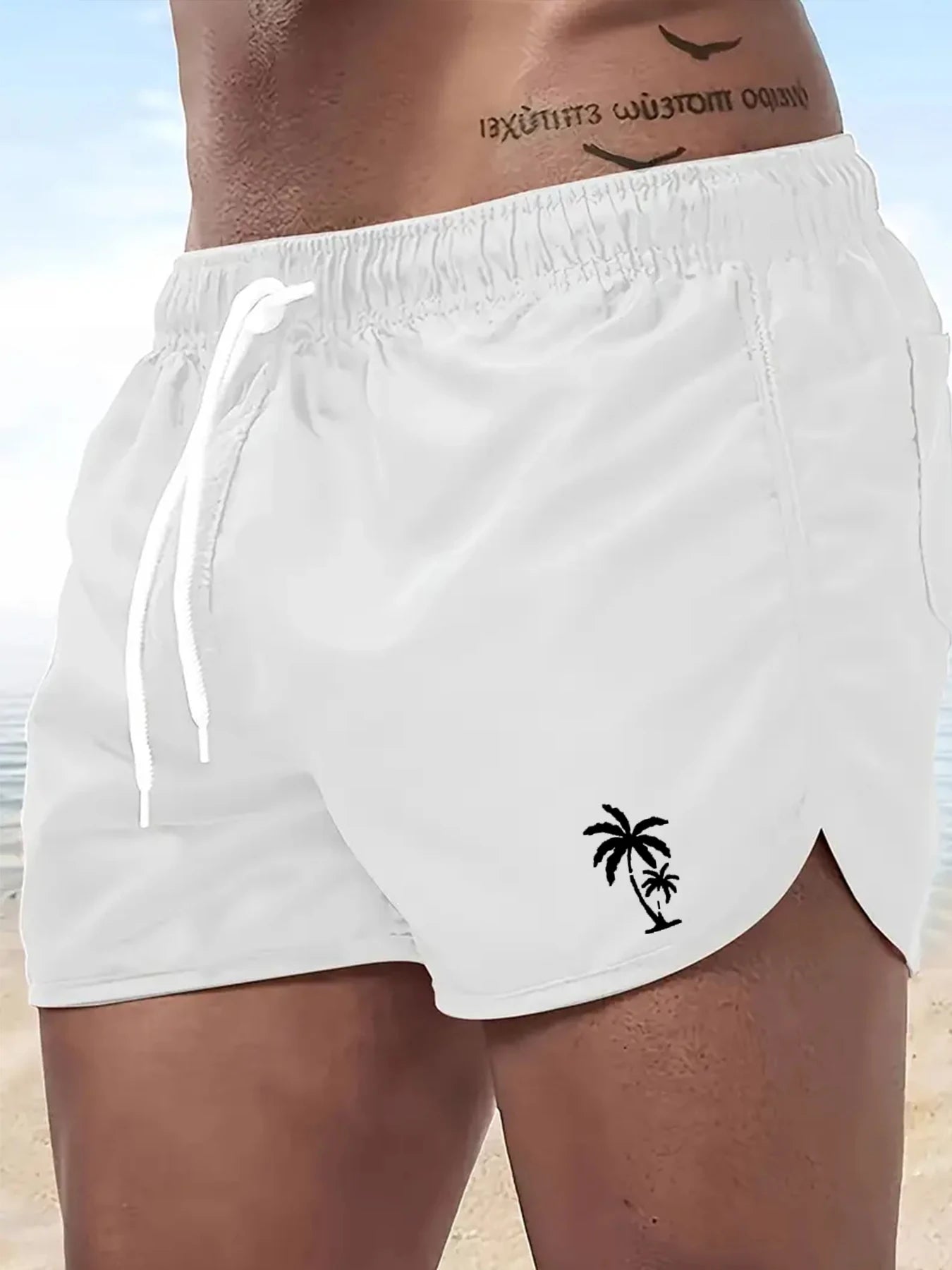LuckeLadybug men's swim trunks in white with palm tree design for beachwear