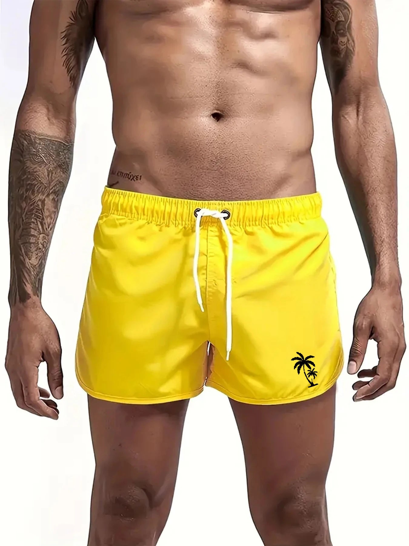 Bright yellow boardshorts by LuckeLadybug LLC for men in swim trunks with palm tree design