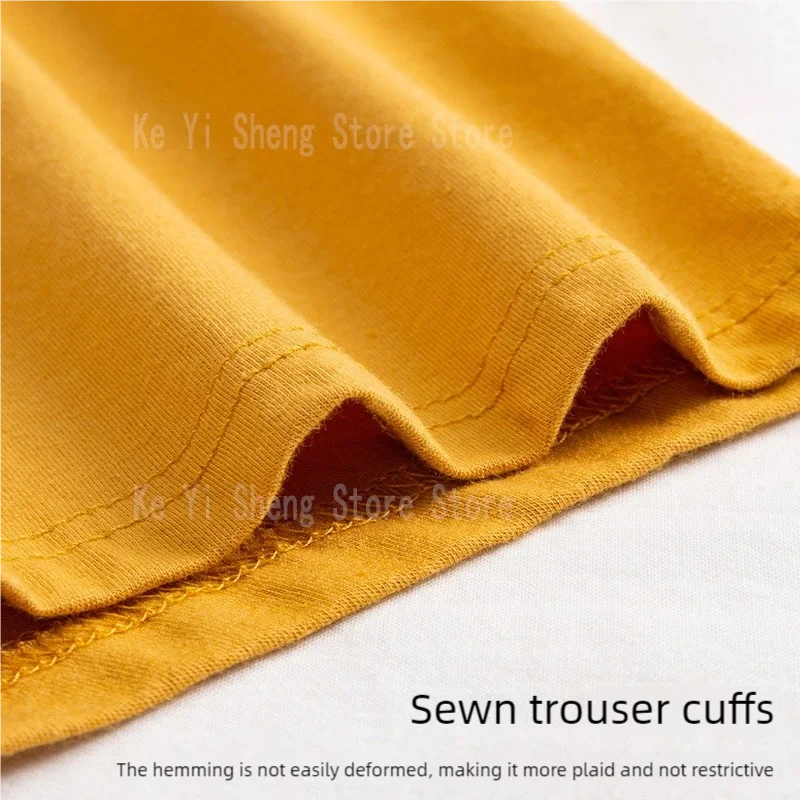 Close-up of sewn cuffs on men's breathable underwear set in vibrant yellow fabric