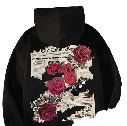 Men's rose print hoodie featuring a graphic of torn newspaper and vibrant red roses