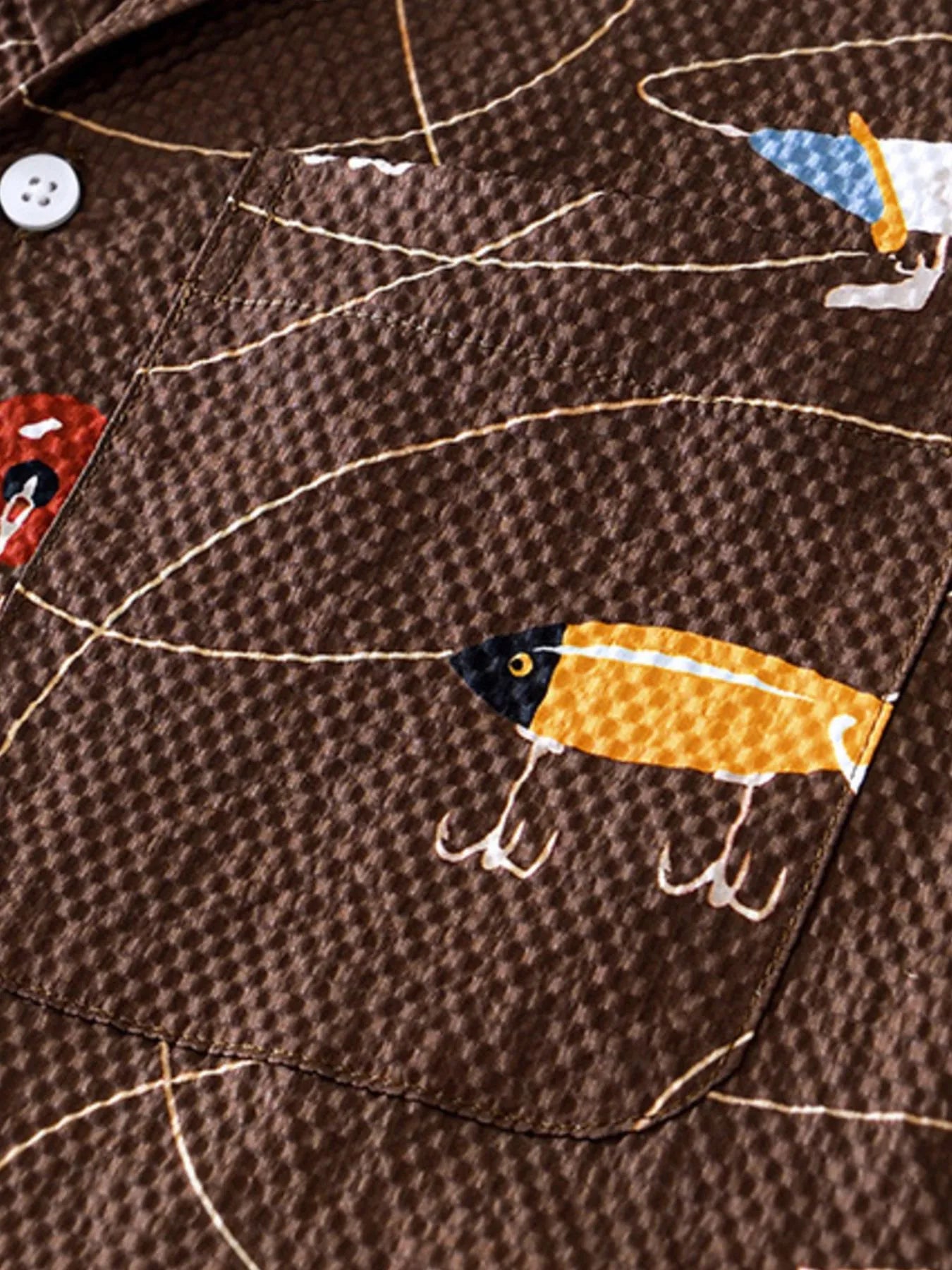 LuckeLadybug LLC men's t shirt graphics with colorful fishing lure print on brown fabric