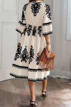 LuckeLadybug LLC Fit & Flare Midi Dress with Black Floral Design and Flared Sleeves