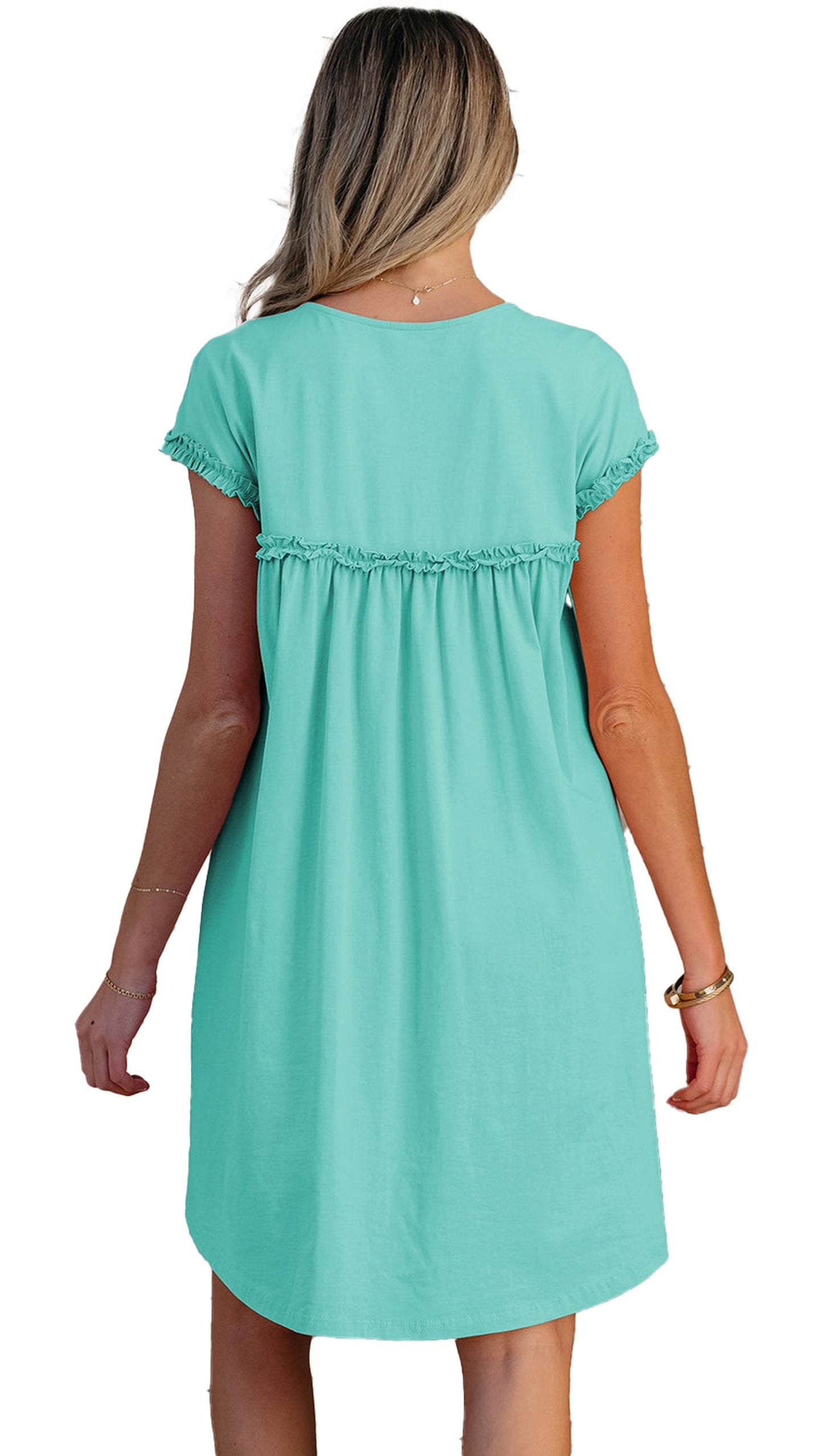 Back view of a mint green mini dress with a relaxed fit and ruffled detailing from LuckeLadybug