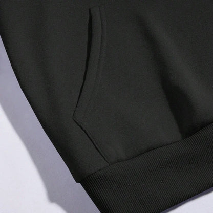 Close-up of a black moon print hoodie for women featuring a kangaroo pocket and ribbed cuffs