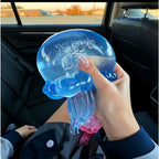 Hand holding a blue squishy jellyfish sensory fidget toy for stress relief and focus