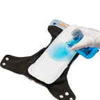 LuckeLadybug LLC Newborn Diapers newborn with absorbent layer demonstrated with liquid spill