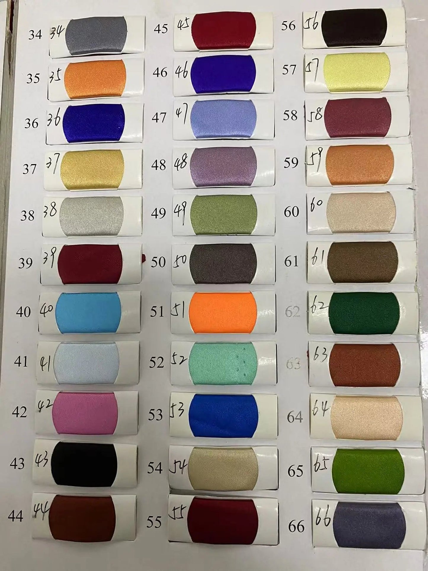 Color swatches for off shoulder mermaid evening dress by LuckeLadybug LLC showcasing various fabric options