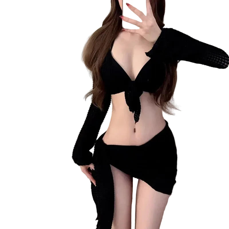 Black one piece bikini swimsuit with stylish cutouts and a chic tie detail for a trendy beach look