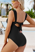 Stylish black one piece swimsuit bathing suits with back bow detail for a chic beach look