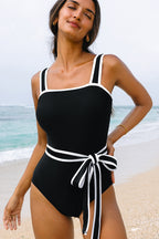 LuckeLadybug LLC One Piece Swimsuit Bathing Suits in Black with White Accents and Stylish Belt