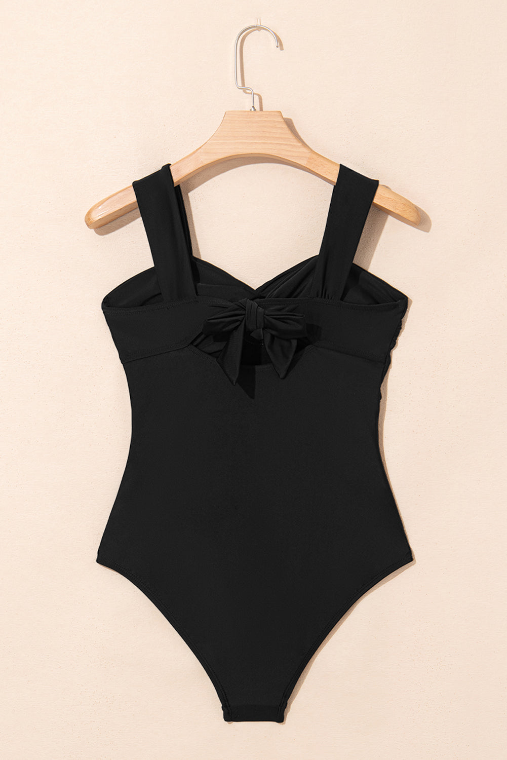 Stylish black one piece swimsuit bathing suits with bow detail for a chic beach look