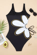 Black one piece swimsuit bathing suits with white flower design and adjustable straps for stylish beach days
