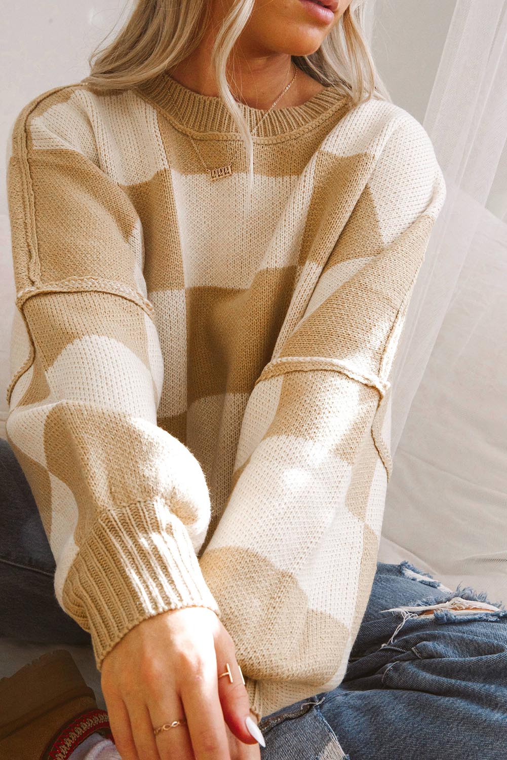 LuckeLadybug orange checkered bishop sleeve sweater in a cozy design for stylish layering