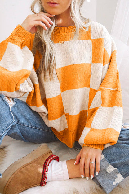 LuckeLadybug orange checkered bishop sleeve sweater in a cozy oversized style, perfect for casual wear.