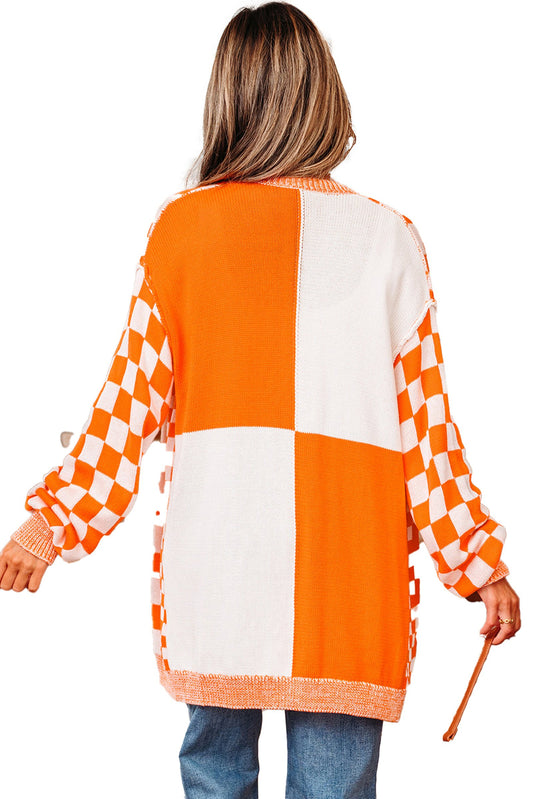 Orange checkered cardigan featuring a stylish design with oversized sleeves and a cozy fit