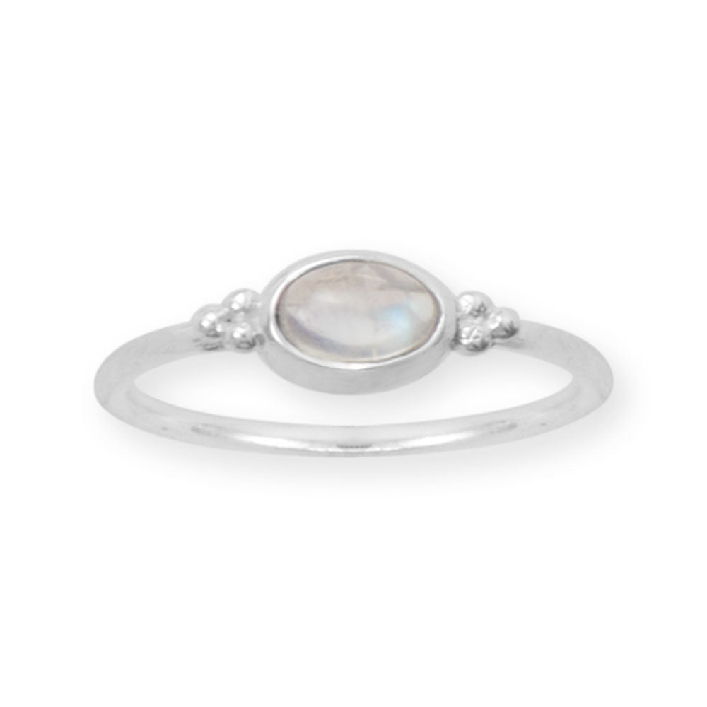 Delicate oval rainbow moonstone ring by LuckeLadybug LLC with simple silver band and elegant design