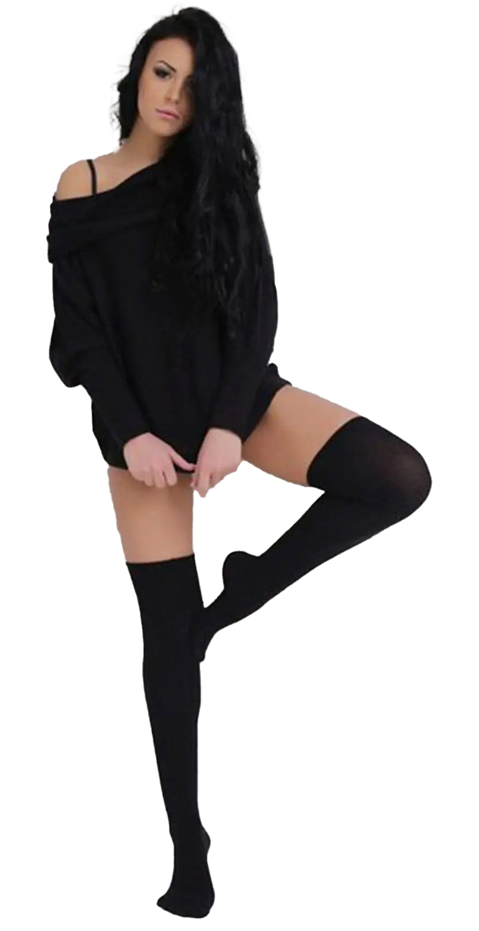 Stylish model wearing over the knee black socks for women with a relaxed black sweater