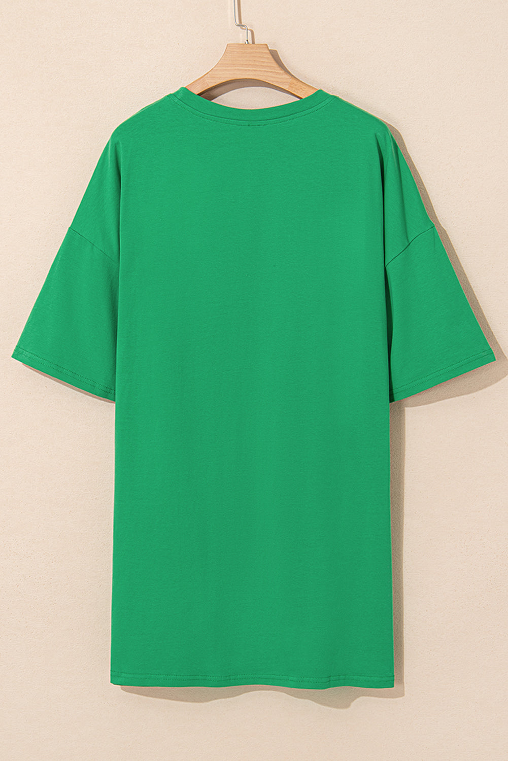 Back view of a green oversized t-shirt from LuckeLadybug LLC, perfect for casual wear