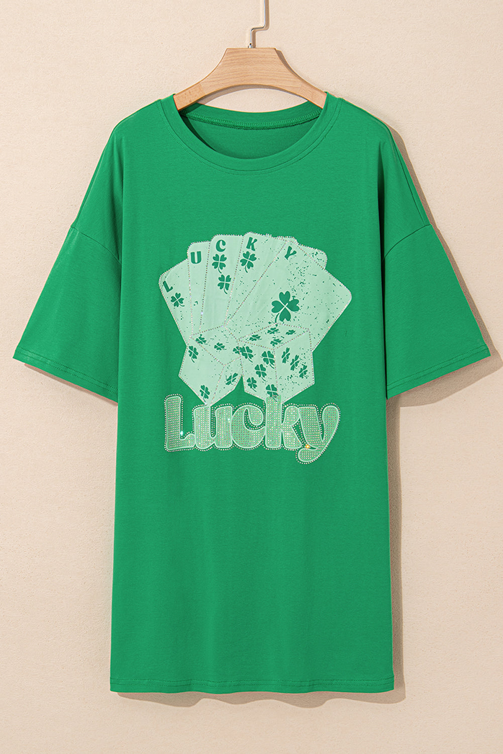 Green oversized t-shirt with a lucky card design for a casual and comfortable look