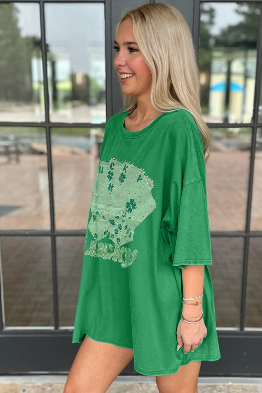Green oversized t-shirt from LuckeLadybug LLC featuring a playful graphic design