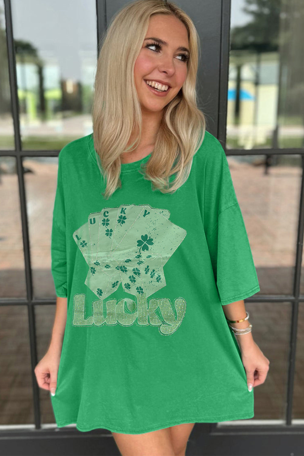 Green oversized t-shirt from LuckeLadybug LLC featuring a playful lucky graphic design