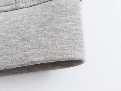Close-up view of gray fabric showcasing the cuff of an oversized zip up hoodie for women