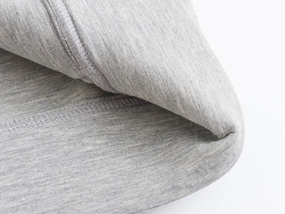 Soft gray fabric of an oversized zip up hoodie for women, showcasing its cozy texture and design