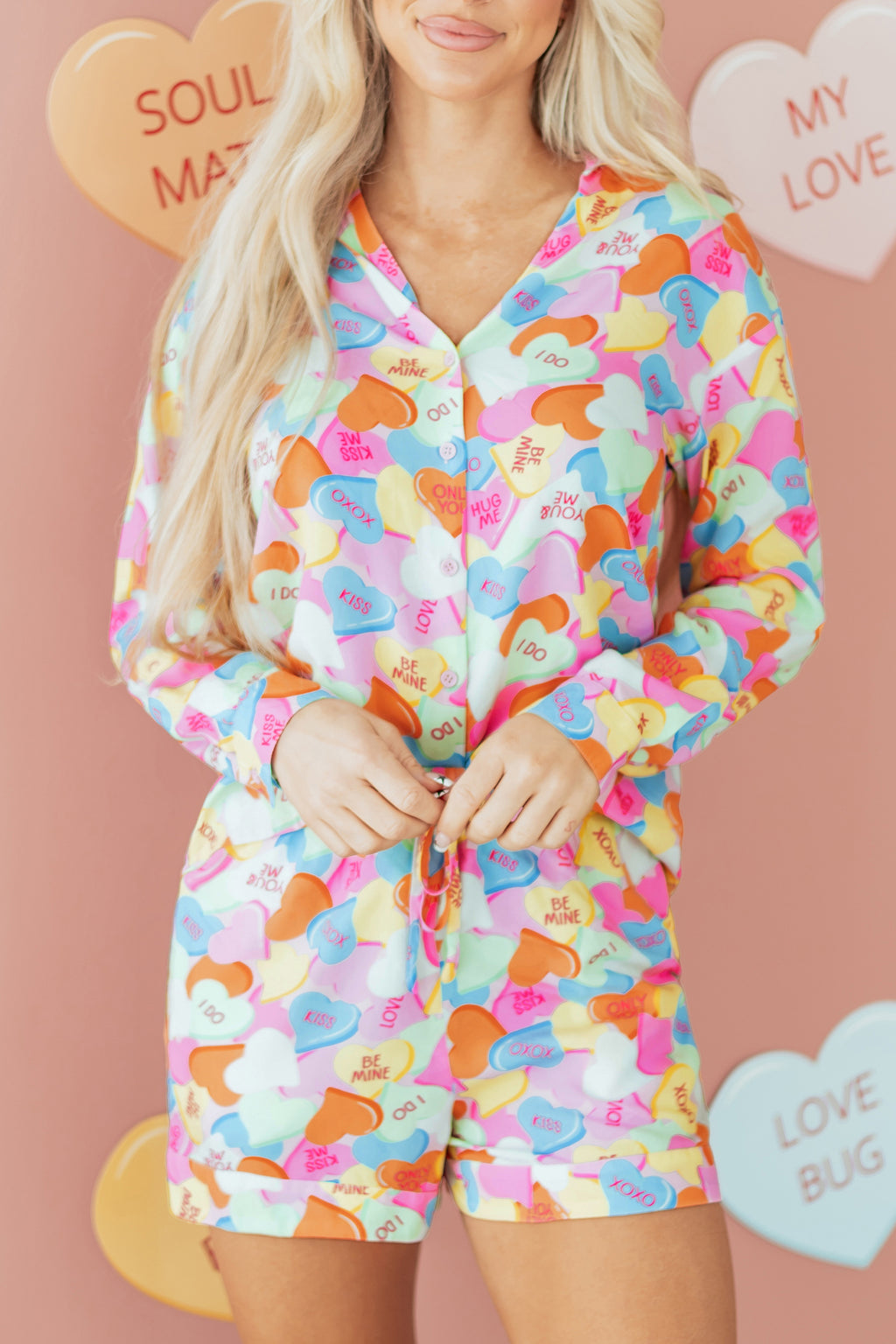 Colorful LuckeLadybug LLC pajama set with short sleeves and matching shorts featuring playful heart designs