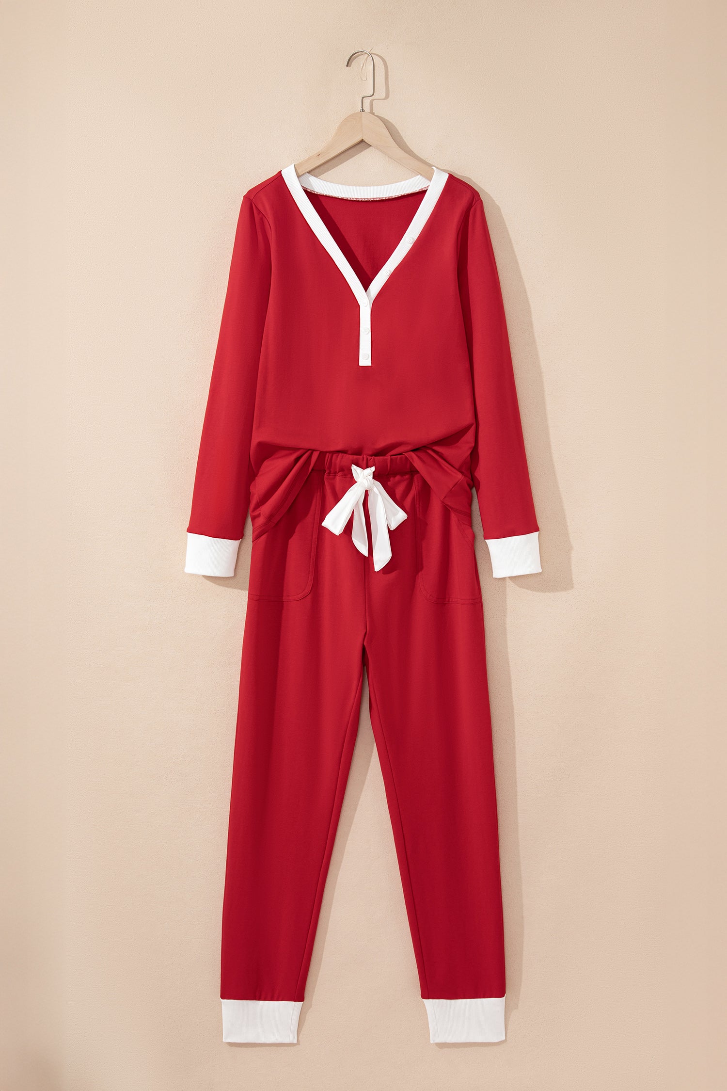 Red LuckeLadybug LLC pajama set with a stylish V-neck top and matching pants
