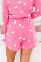 Pink shorts with white heart to print pattern, perfect for casual and cozy wear