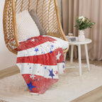 LuckeLadybug sherpa blanket patriotic bedding throw with red white and blue star design draped over wicker hanging chair