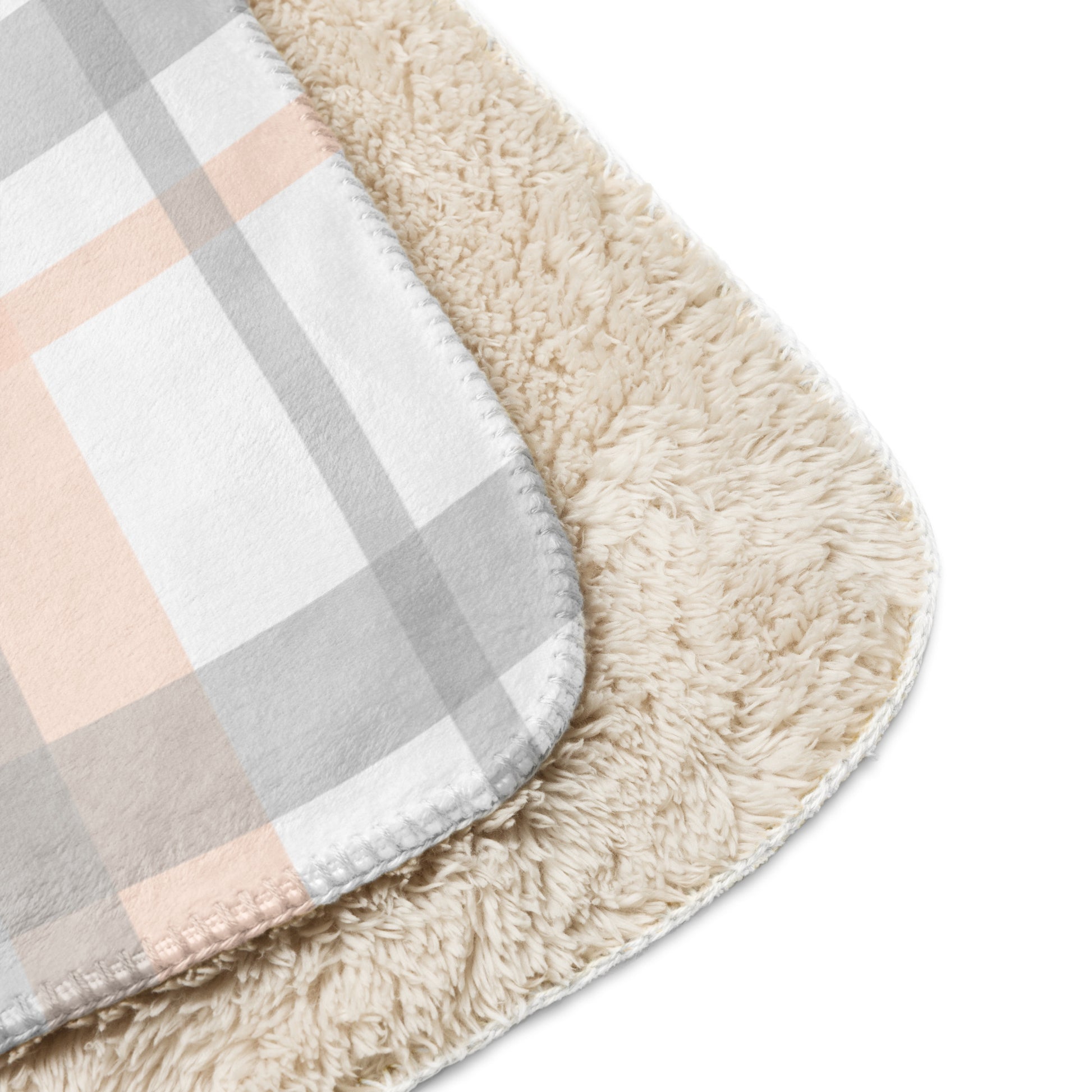 LuckeLadybug peach grey plaid sherpa blanket showing soft plaid pattern and fluffy sherpa lining