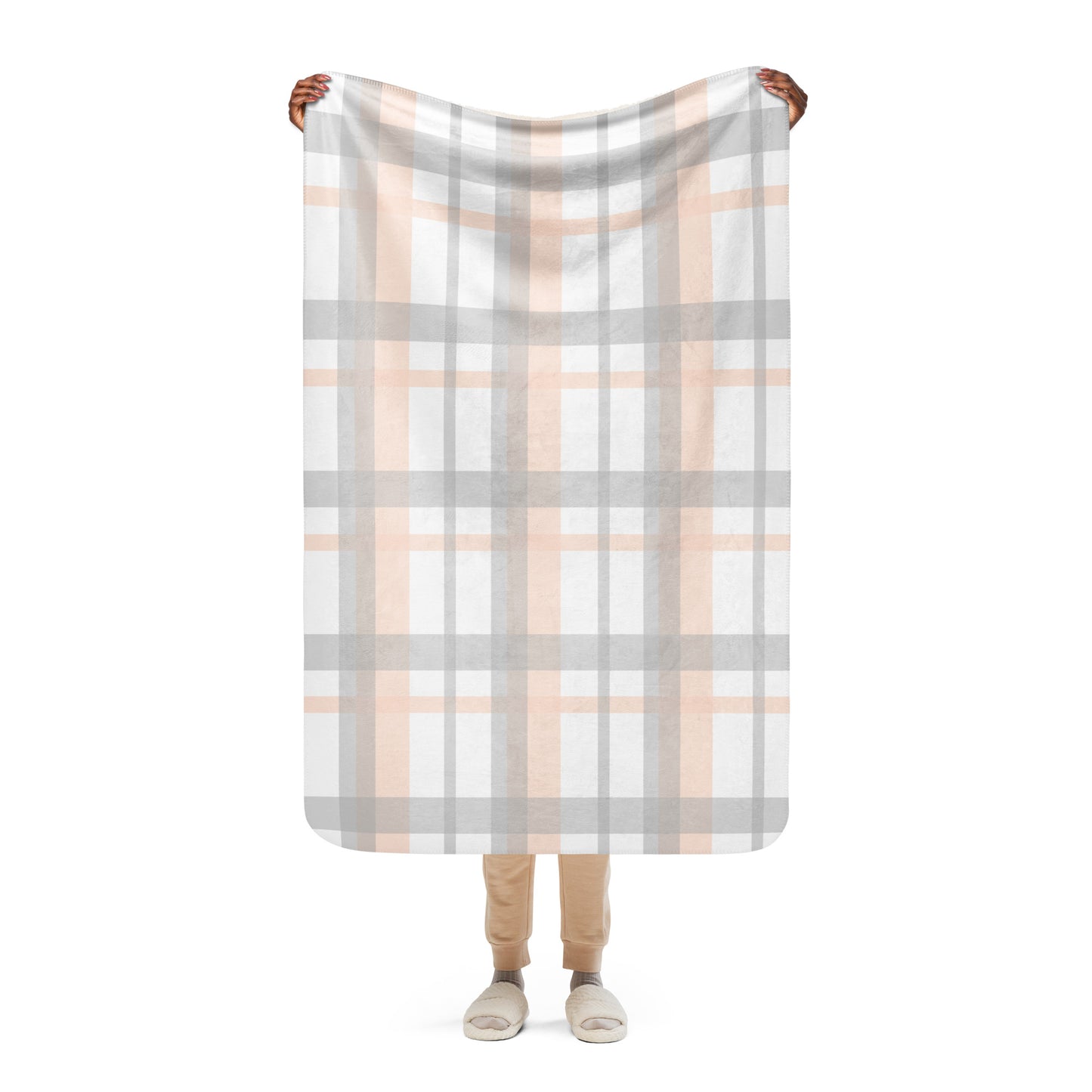LuckeLadybug peach grey plaid sherpa blanket held up by person showing full pattern and soft texture