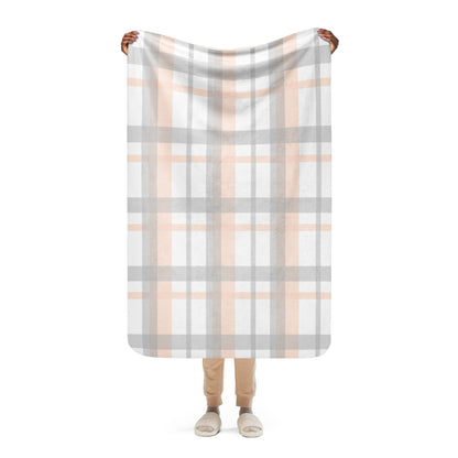 LuckeLadybug peach grey plaid sherpa blanket held up by person showing full pattern and soft texture
