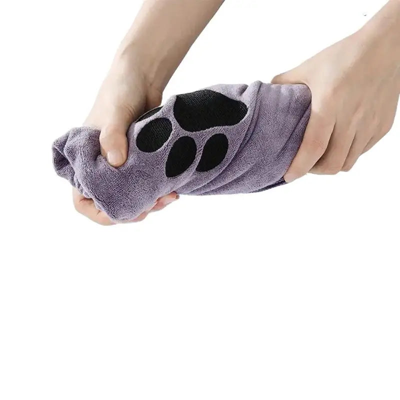 Soft and fluffy LuckeLadybug absorbent towel with cute paw print design, ideal for pets and drying
