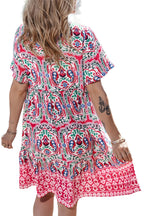 Pink bohemian short dress with colorful floral patterns and a relaxed fit, perfect for summer outings