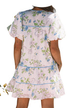 Back view of a LuckeLadybug pink floral mini dress with puff sleeves and tiered design