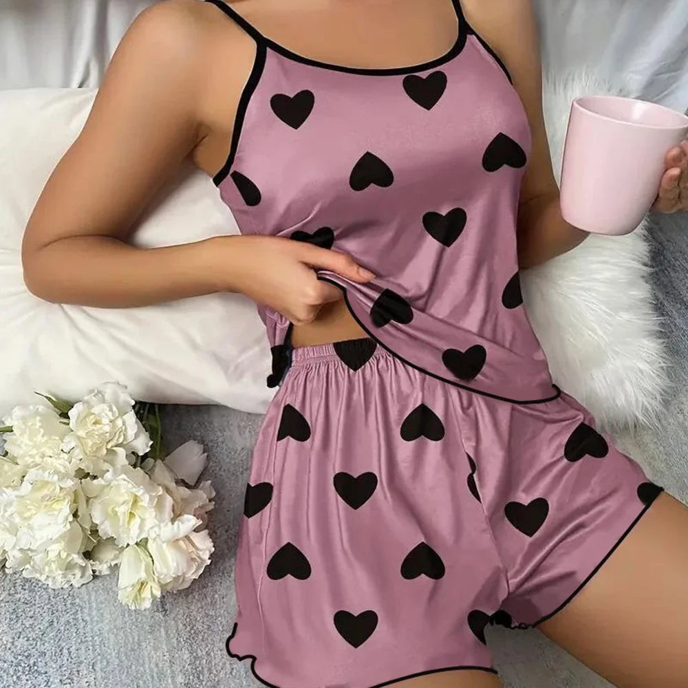 Pink heart print pajama set featuring a sleeveless top and shorts with a comfortable fit