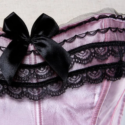Elegant pink lace overbust corset for women featuring black lace trim and bow detail